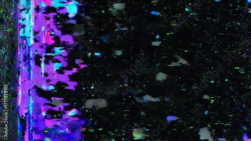 Abstract display of multicolored inclusions in a dark background