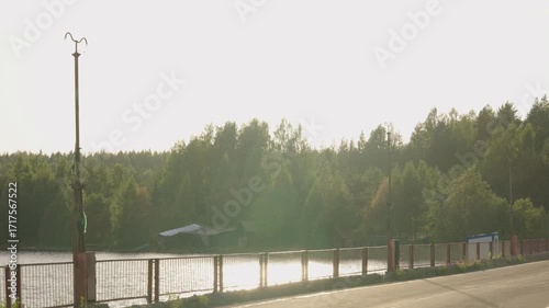 A Beautifully Scenic Riverside View Showcasing Lush Greenery Bathed in Bright Sunlight