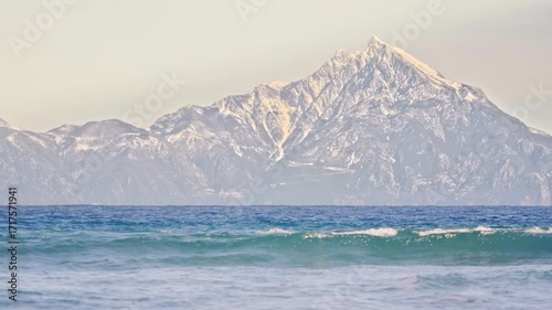 Beautiful seascape, Mount Athos dramatic high peak, waves, blue water, Greece