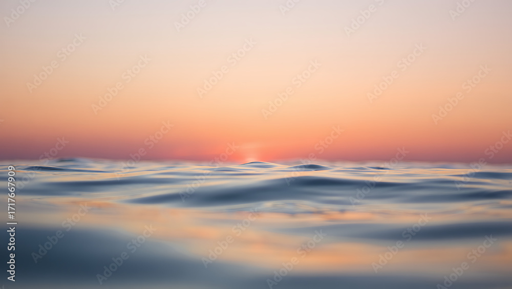 Obraz premium Gentle ocean waves reflect the soft hues of a pastel sunset, creating a serene and tranquil atmosphere