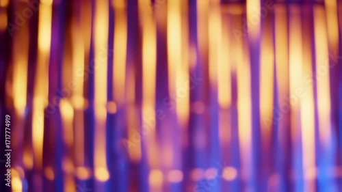 Abstract blurred vertical lights in vibrant purple and orange