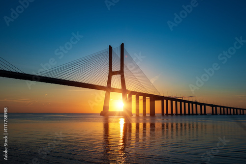 Valokuva Vasco da Gamma road bridge in Portuguese capital Lisbon at sunrise
