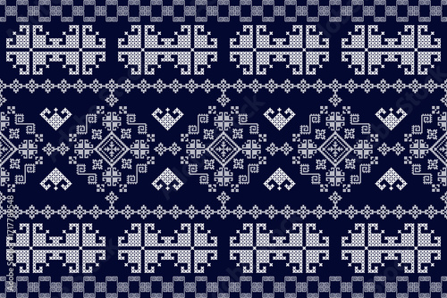 A seamless horizontal border pattern of native textile. Featuring white pixelated geometric shapes on a navy blue background, suitable for fabric trims and design work.