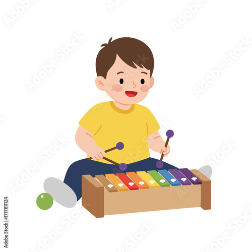 a toddler sitting on the floor, wearing a bright yellow t-shirt, happily striking the colorful keys of a xylophone with two small mallets