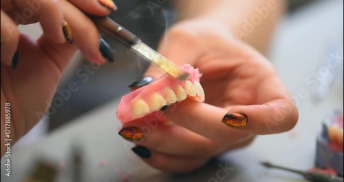 Dental prosthesis, dentures, prosthetics work. A study and a table with dental tools