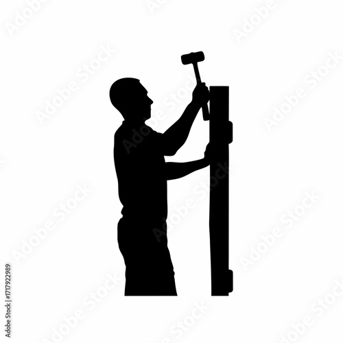 Silhouette of worker aligning machine parts with hammer isolated on white background
