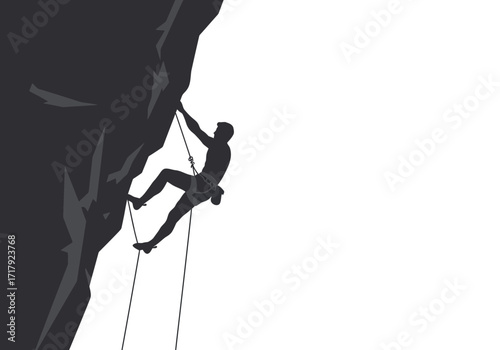 Silhouette of a rock climber ascending a steep cliff face.