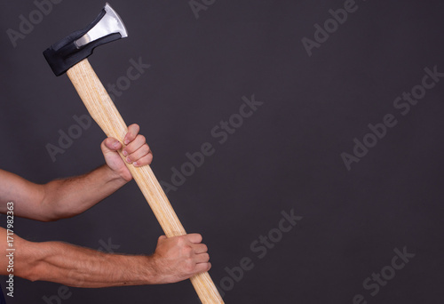 Papier peint Wood chopping axe in hand on grey background
