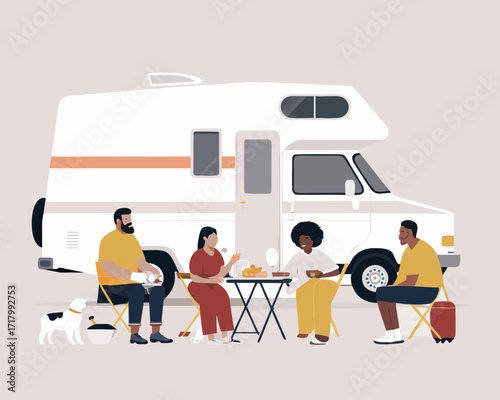 Diverse family and friends enjoying a picnic outside their rv camper van