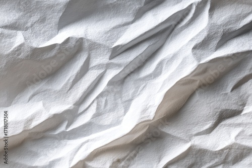Close-up of crumpled white fabric, showing folds and texture