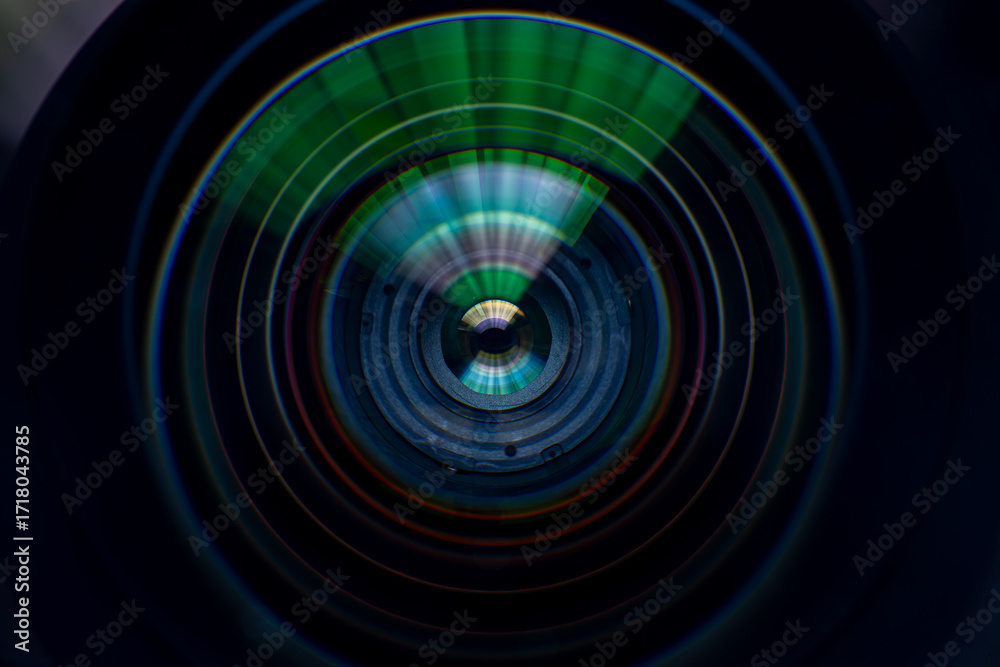 Obraz premium Close-up macro digital camera lens,Photo or video camera lens with light reflections close-up on the black background.