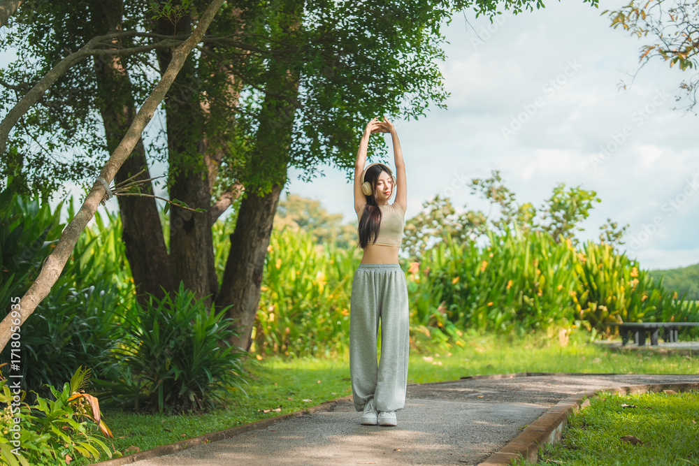 custom made wallpaper toronto digitalA sporty woman in sportswear exercises at the garden