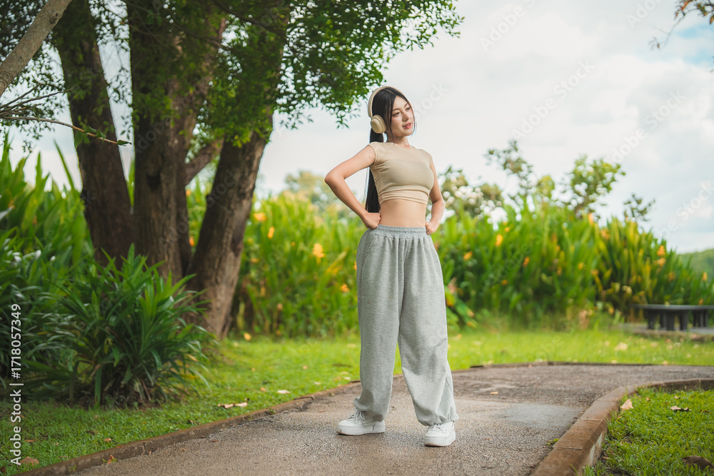 custom made wallpaper toronto digitalA sporty woman in sportswear exercises at the garden