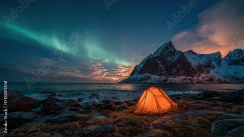 Mountains Snow. Camping Adventure in Lofoten with Aurora Above Sea and Sky © Maryna