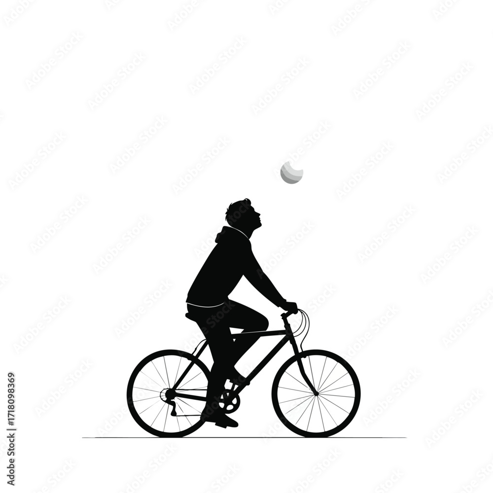 Obraz premium Black silhouette of a person in a hoodie riding a bicycle while looking up at a ball in the air.