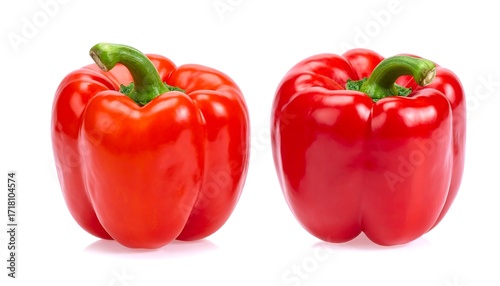 Two red bell peppers isolated on white