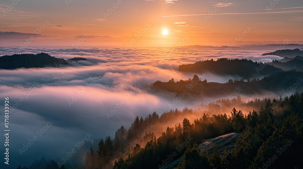 Fototapeta premium Sunrise over misty mountaintops