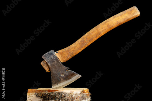 Antique axe with wooden handle on black background
