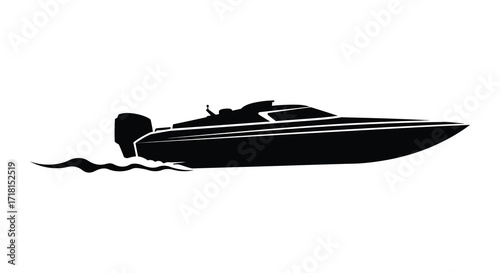 Silhouetted speedboat moving quickly across the water with a wake