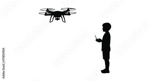 Silhouette of a boy operating a quadcopter drone with remote control