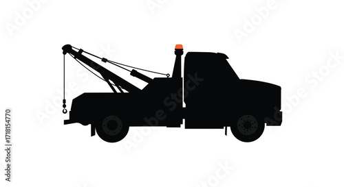 Silhouette of a tow truck vehicle against a plain white background