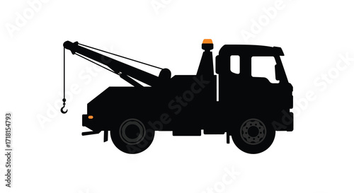 Silhouette of a black tow truck with an orange warning light