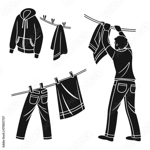 Man hanging laundry on a clothesline with jeans and hoodie