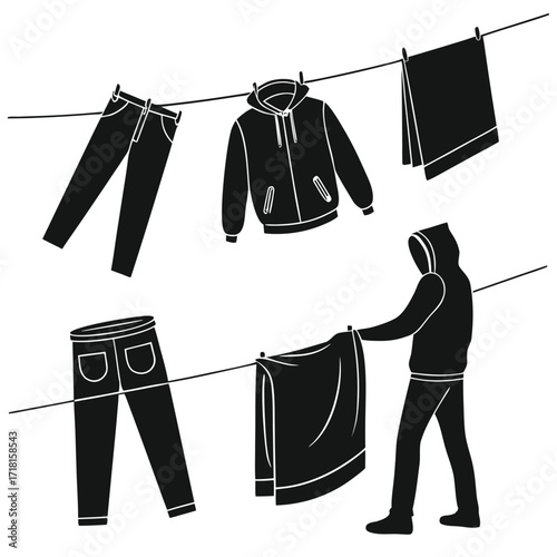Person hanging laundry on clotheslines drying