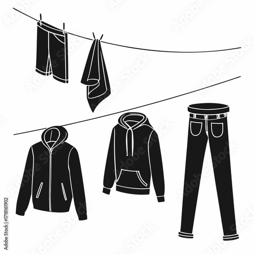 Various clothing items on clotheslines hanging drying