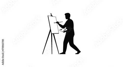 Silhouette of an artist painting on a canvas with an easel