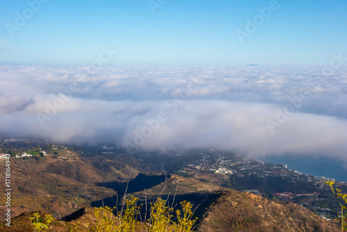 Marine layer rolling in over the Pacific Coast and Getty Villa, taken from Parker Mesa Overlook .