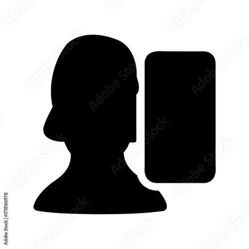Silhouette of a person with a hat, interacting with a mobile phone