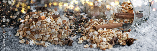 winter hot drink ingredient spiled with spices, sugar and glass cup turn over...