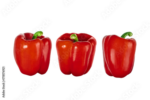 Three red bell peppers isolated on transparent background. Fresh vegetable with green stem, perfect for healthy food, cooking, and vegetarian design concepts.