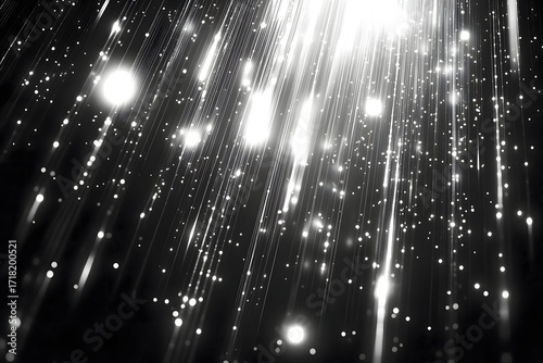 Abstract silver glitter background with sparkling light rays and bokeh for christmas design