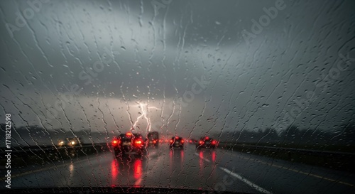 Driving Through a Severe Thunderstorm with Lightning Strikes Visible