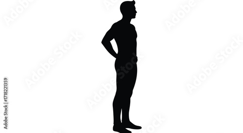 Silhouette of a muscular man standing in a relaxed pose side view