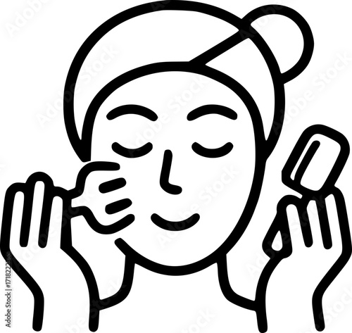 Woman applying facial treatment with skincare tools indoors  