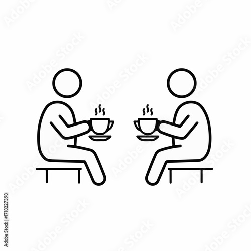 Two people enjoying a warm beverage together, sharing a moment of conversation.