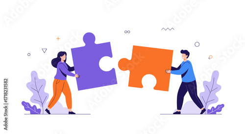 Two people connecting large puzzle pieces symbolizing teamwork and collaboration.
