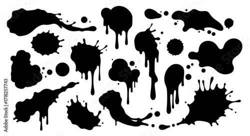 Assorted ink blots and splatters arranged in a group on a clean white presentation area view