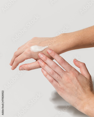 Woman using beef tallow moisturizer on hands
