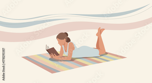 Young Woman Reading Book While Lying on Mat Enjoying Pleasant Moments of Leisure