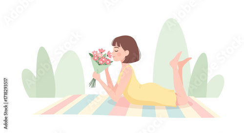 Young Woman Relaxes Outdoors, Enjoying Fragrant Flowers and Sunshine on a Vibrant Mat