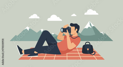 Photographer Relaxing On A Picnic Blanket Capturing The Beauty Of Nature In Mountains