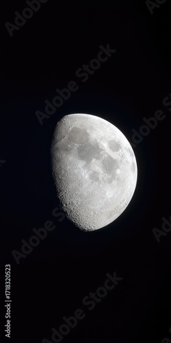 A detailed image of a waxing crescent moon against a deep black night sky.