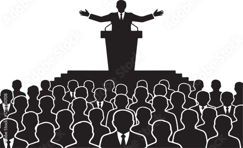 Speaker at podium addressing a large crowd of silhouetted people speech presentation