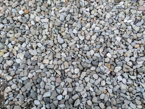 A pile of rocks in a natural setting. The rocks are of various shapes, sizes, and colors.