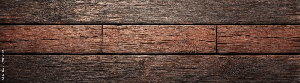 Fototapeta premium The natural grain patterns and knots in dark, rustic wooden planks give them a warm and aged appearance, ideal for use as backgrounds or design elements