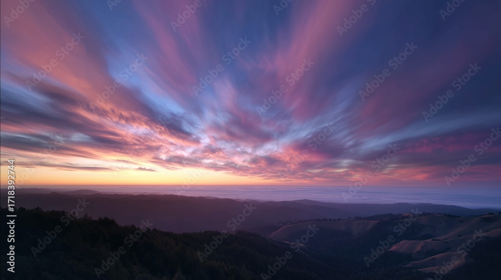 Fototapeta premium Vibrant sunset sky over mountain landscape colorful cloudscape background